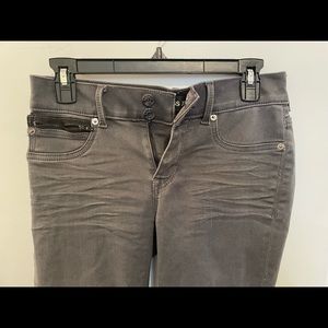Express Jeans/ Jeggings with black zipper and nice button details.